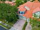 Aerial view of a charming townhome with brick driveway at 7126 Regina Way, Orlando, FL 32819