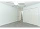 Light and airy bedroom with grey carpet and double door closet at 7126 Regina Way, Orlando, FL 32819