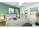Relaxing bedroom with green accent wall and stylish decor at 7126 Regina Way, Orlando, FL 32819