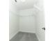 Walk-in closet with wire shelving and grey carpeting at 7126 Regina Way, Orlando, FL 32819