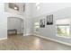 Open living room with high ceilings and neutral color palette at 7126 Regina Way, Orlando, FL 32819