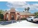 Community center with Spanish-style architecture and ample parking at 7126 Regina Way, Orlando, FL 32819