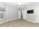 Spacious bedroom featuring wood-look floors and access to upper floor at 7126 Regina Way, Orlando, FL 32819