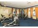 Well-equipped fitness center with cardio and weight machines at 7126 Regina Way, Orlando, FL 32819