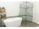 Spa-like bathroom with soaking tub and walk-in shower at 7126 Regina Way, Orlando, FL 32819