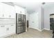 Kitchen features stainless steel appliances and ample pantry storage at 7126 Regina Way, Orlando, FL 32819