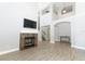 Spacious living room with high ceilings, fireplace, and hardwood floors at 7126 Regina Way, Orlando, FL 32819