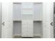 Bright walk-in closet with built-in shelves and drawers at 7126 Regina Way, Orlando, FL 32819