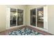 Brick patio with sliding glass doors leading to the kitchen at 7126 Regina Way, Orlando, FL 32819