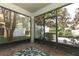 Relaxing screened patio with brick flooring and access to backyard at 7126 Regina Way, Orlando, FL 32819