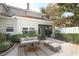 Inviting patio with wicker furniture and plenty of space for relaxing at 7126 Regina Way, Orlando, FL 32819