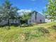 Large backyard with garden and plenty of space for outdoor activities at 5411 Great Egret Dr, Leesburg, FL 34748
