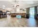 Spacious living room with tile floors, sectional sofa, and high ceilings at 5411 Great Egret Dr, Leesburg, FL 34748