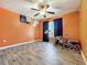 Bedroom with drum set and ceiling fan at 5411 Great Egret Dr, Leesburg, FL 34748