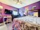 Spacious bedroom with large bed, desk, and TV at 5411 Great Egret Dr, Leesburg, FL 34748