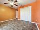 Bedroom with double door closet and ceiling fan at 5411 Great Egret Dr, Leesburg, FL 34748