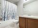 Clean bathroom with shower/tub combo and wood vanity at 5411 Great Egret Dr, Leesburg, FL 34748