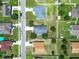 Overhead view showcasing a suburban neighborhood with homes and landscaping at 5411 Great Egret Dr, Leesburg, FL 34748