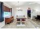 Dining area features a long farmhouse table and antique-style hutch at 5411 Great Egret Dr, Leesburg, FL 34748