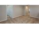 Upstairs hallway with neutral colored carpet and doors to bedrooms at 4034 Gardenia Ave, Lake Hamilton, FL 33851