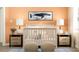 Bedroom with crib, nightstands, and whale artwork at 2576 Skyline Loop, Kissimmee, FL 34758