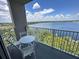 Balcony with lake view and seating at 13415 Blue Heron Beach Dr # 1101, Orlando, FL 32821