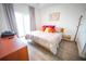 Bright bedroom with king-size bed and balcony access at 13415 Blue Heron Beach Dr # 1101, Orlando, FL 32821