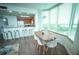 Bright dining area with kitchen view and bay window at 13415 Blue Heron Beach Dr # 1101, Orlando, FL 32821