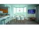 Dining area with bay window and modern table set at 13415 Blue Heron Beach Dr # 1101, Orlando, FL 32821