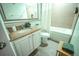 Bathroom with a bathtub, granite countertop vanity, and updated fixtures at 13415 Blue Heron Beach Dr # 1101, Orlando, FL 32821