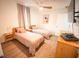 Cozy bedroom with twin beds, light wood furniture, and calming decor at 13415 Blue Heron Beach Dr # 1101, Orlando, FL 32821
