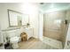 Clean bathroom with a walk-in shower, grab bars, and modern vanity at 13415 Blue Heron Beach Dr # 1101, Orlando, FL 32821