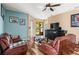 Relaxing living room with leather couches and hardwood floors at 6269 Silver Leaf Ln, Lakeland, FL 33813