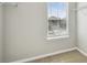 Walk-in closet with built-in shelving and a window for natural light at 293 Woodsage Pl, Lake Alfred, FL 33850