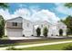 Four-unit townhome community with attached garages and front yards at 4329 Hillock Blvd, Haines City, FL 33844