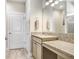 Clean bathroom with granite vanity and tiled flooring at 251 Tomelloso Way, Davenport, FL 33837