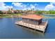 Lakeside gazebo with a large deck, perfect for gatherings at 251 Tomelloso Way, Davenport, FL 33837