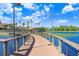 Curving boardwalk path alongside a lake in a community at 251 Tomelloso Way, Davenport, FL 33837