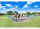 Fenced playground with play structures for  at 251 Tomelloso Way, Davenport, FL 33837
