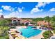 Resort-style pool with ample lounge chairs and umbrellas at 251 Tomelloso Way, Davenport, FL 33837