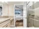 Bathroom with granite countertop and large walk-in shower at 251 Tomelloso Way, Davenport, FL 33837