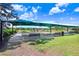 Bocce ball courts with shade structure and benches at 251 Tomelloso Way, Davenport, FL 33837
