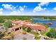 Aerial view of community clubhouse and surrounding landscape at 251 Tomelloso Way, Davenport, FL 33837