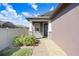 Inviting front entry with stone accents and landscaping at 251 Tomelloso Way, Davenport, FL 33837