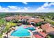 Resort-style community pool with expansive sundeck and clubhouse at 251 Tomelloso Way, Davenport, FL 33837
