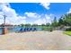Relaxing lakefront patio with lounge chairs and a beautiful view at 251 Tomelloso Way, Davenport, FL 33837