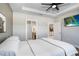 Bedroom with ensuite bathroom access and a view of the kitchen at 251 Tomelloso Way, Davenport, FL 33837