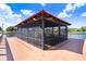 Screened gazebo on a deck overlooking a lake at 251 Tomelloso Way, Davenport, FL 33837