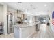 Modern kitchen with large island, granite countertops and stainless steel appliances at 251 Tomelloso Way, Davenport, FL 33837