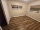 Bedroom featuring wood-look floors and neutral wall colors at 3414 Portersfield Rd, Orlando, FL 32808